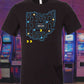 Image of a black t-shirt featuring a graphic design where the outline of the state of Ohio is transformed into a Pac-Man game level, complete with dots, ghosts, and Pac-Man himself navigating the maze.